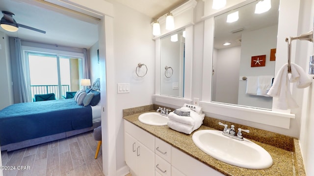 11807 Front Beach Rd Unit 1-1608, Panama City Beach, FL 32407 - ensuite bathroom with double vanity, wood finished floors, and ceiling fan