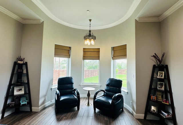 1733 Overhill Dr, San Angelo, TX 76904 - living area featuring healthy amount of natural light, dark wood finished floors, ornamental molding, a chandelier, and baseboards