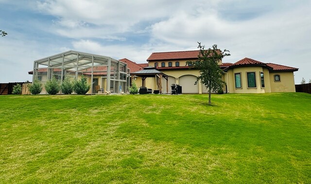 1733 Overhill Dr, San Angelo, TX 76904 - rear view of property featuring a gazebo, stucco siding, and a tile roof