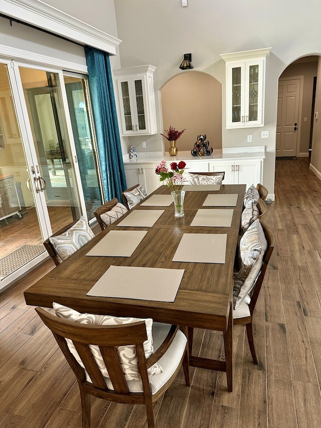 1733 Overhill Dr, San Angelo, TX 76904 - dining area with arched walkways and wood finished floors