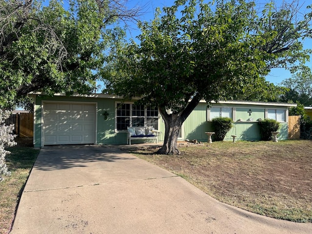 single story home featuring a garage