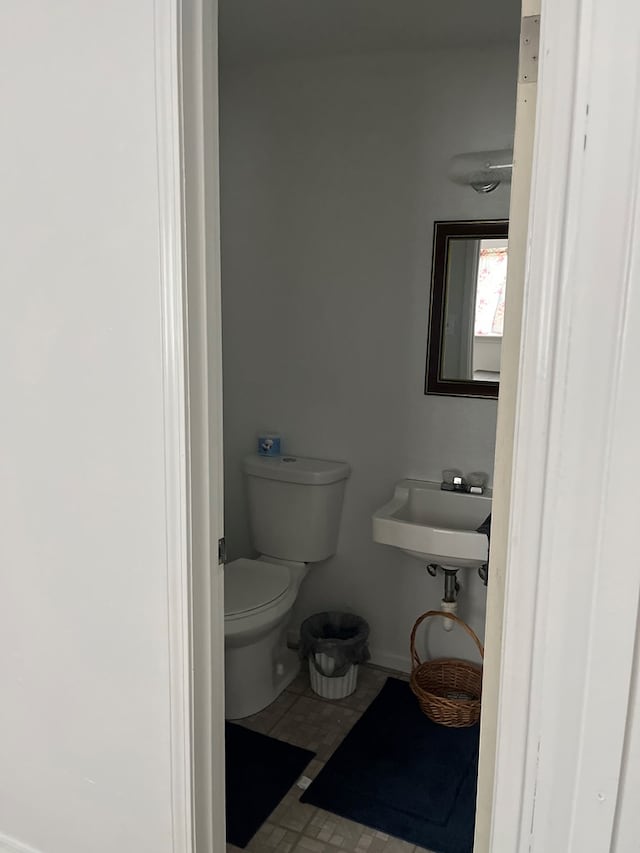 bathroom with toilet and sink