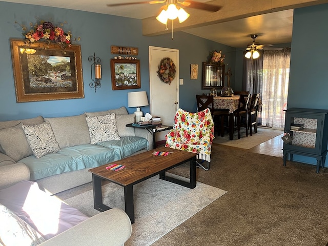 carpeted living room with ceiling fan