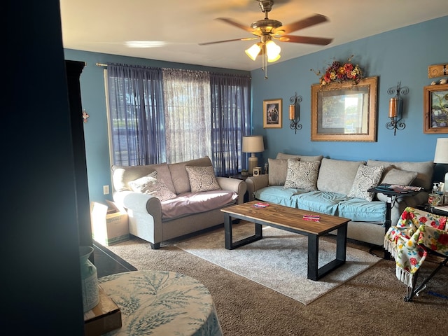 living room featuring carpet floors and ceiling fan