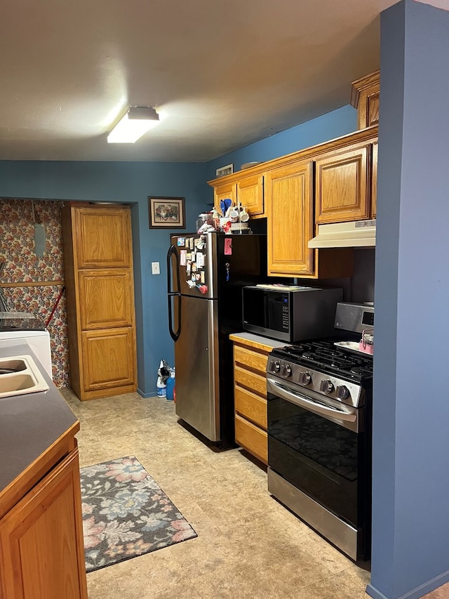 kitchen featuring stainless steel appliances and sink