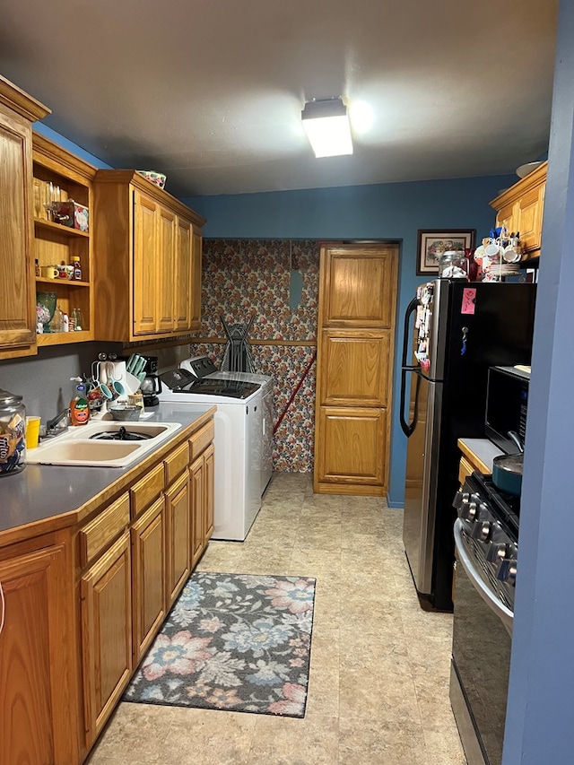 laundry area with sink and washer and dryer