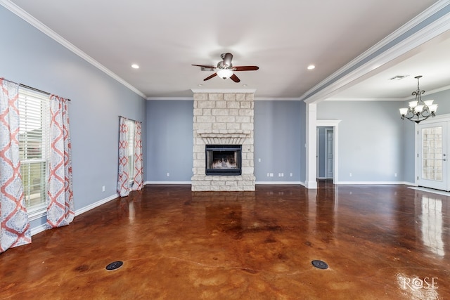unfurnished living room with baseboards, ornamental molding, concrete flooring, a stone fireplace, and ceiling fan with notable chandelier