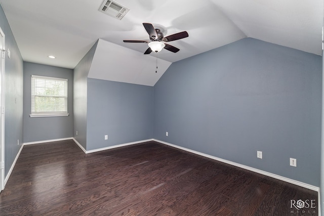 bonus room with visible vents, vaulted ceiling, and dark wood finished floors