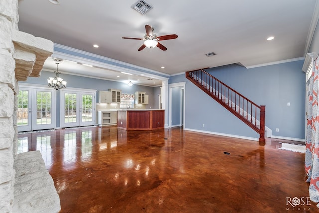 unfurnished living room featuring finished concrete floors, crown molding, visible vents, baseboards, and ceiling fan with notable chandelier
