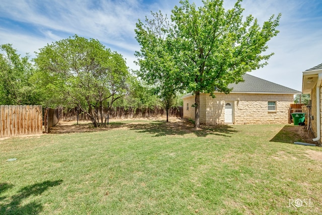 view of yard with a fenced backyard