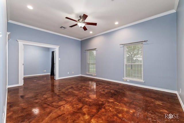 spare room featuring crown molding, a ceiling fan, finished concrete flooring, and baseboards