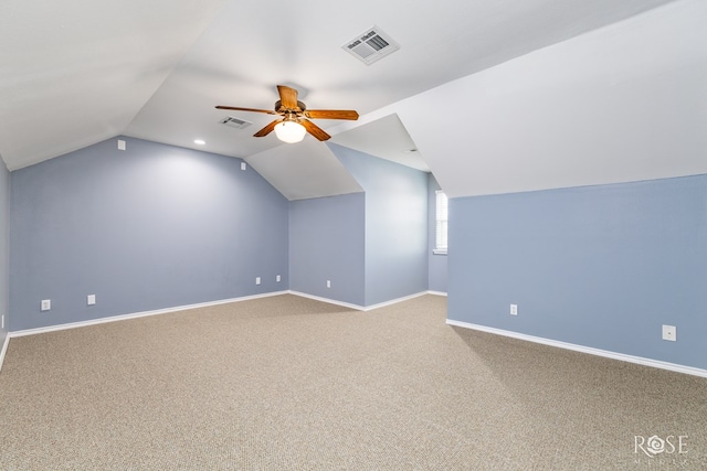 bonus room with carpet flooring, a ceiling fan, visible vents, and baseboards