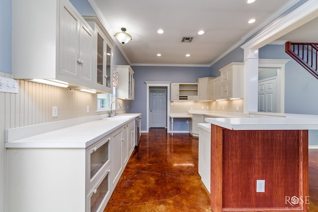 kitchen with glass insert cabinets, open shelves, light countertops, dishwasher, and finished concrete floors