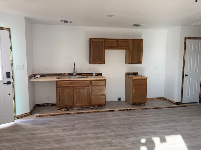 kitchen featuring sink and light hardwood / wood-style flooring