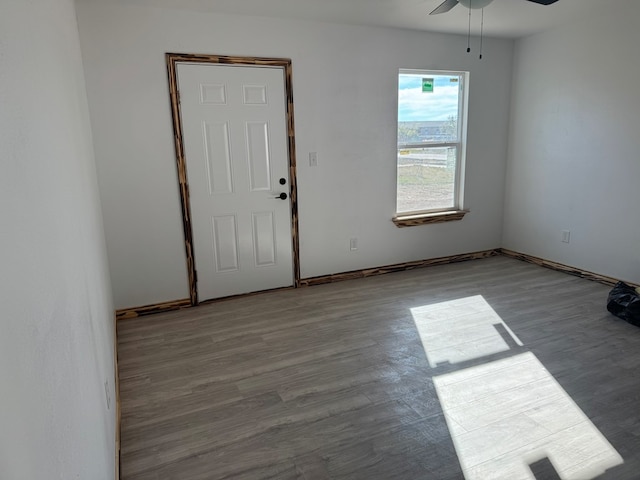 spare room featuring light hardwood / wood-style flooring and ceiling fan