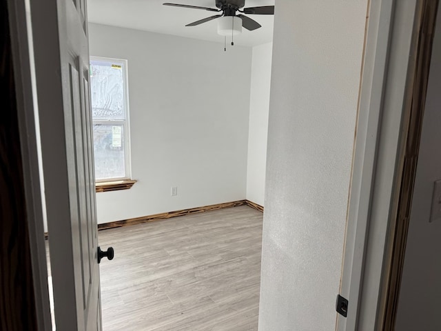 spare room featuring ceiling fan and light hardwood / wood-style floors