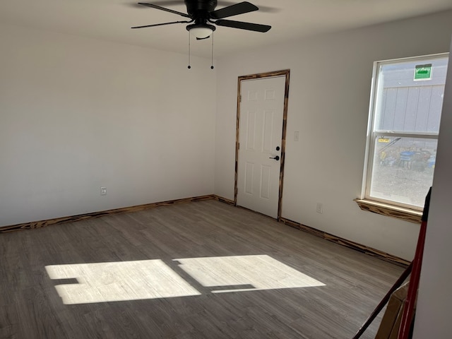 unfurnished room featuring ceiling fan, a wealth of natural light, and light hardwood / wood-style floors