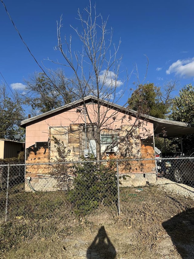 view of property exterior with a carport