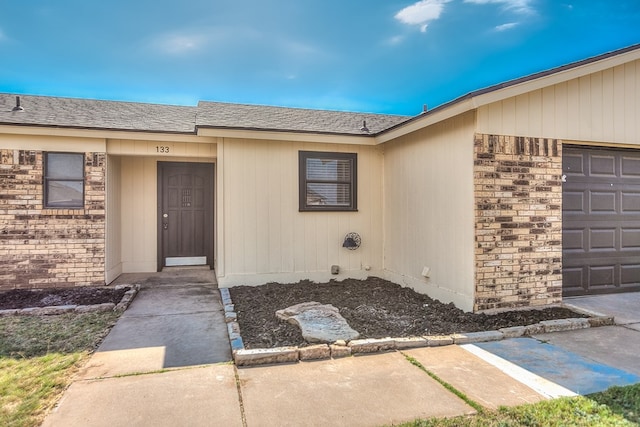 property entrance with a garage