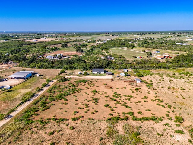 birds eye view of property featuring a rural view