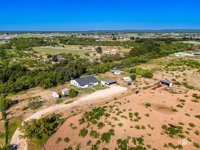 birds eye view of property with a rural view