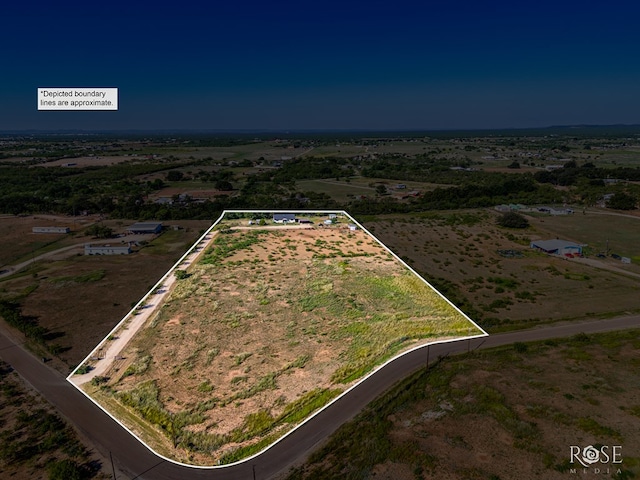 birds eye view of property featuring a rural view