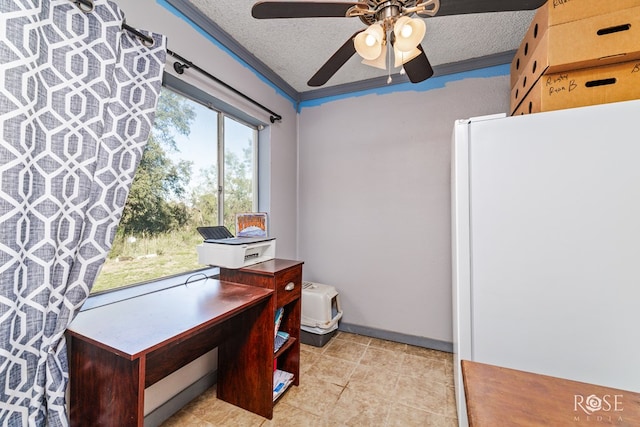 office space with ceiling fan and a textured ceiling