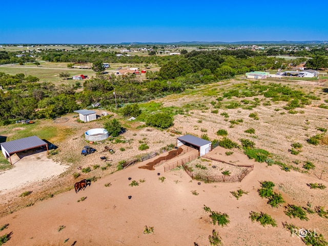 birds eye view of property with a rural view