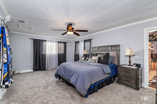 bedroom with crown molding, light colored carpet, and ceiling fan