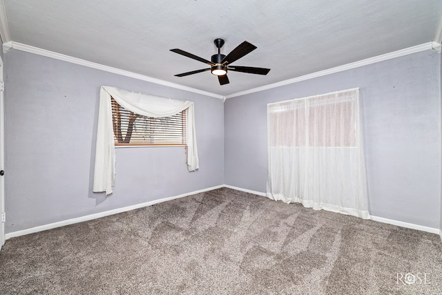 empty room featuring carpet floors, ornamental molding, and ceiling fan