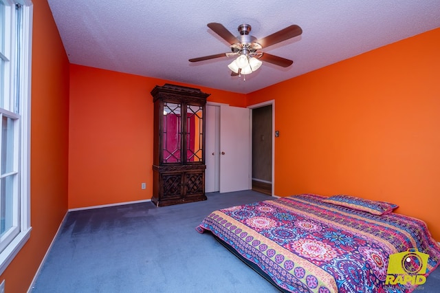 2720 Tanglewood Dr, San Angelo, TX 76904 - bedroom with carpet floors, a textured ceiling, and ceiling fan