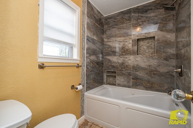2720 Tanglewood Dr, San Angelo, TX 76904 - bathroom with toilet, baseboards, washtub / shower combination, and a textured wall