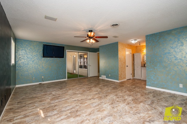 2720 Tanglewood Dr, San Angelo, TX 76904 - empty room featuring a ceiling fan, a textured ceiling, and baseboards