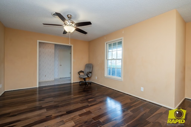 2720 Tanglewood Dr, San Angelo, TX 76904 - empty room with wood finished floors, a ceiling fan, and a textured ceiling