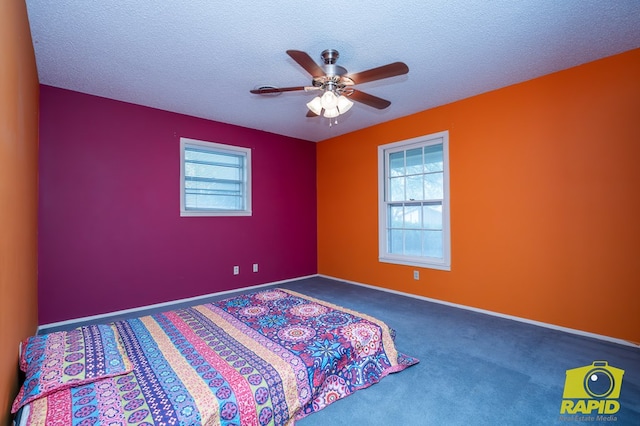 2720 Tanglewood Dr, San Angelo, TX 76904 - bedroom with a textured ceiling, carpet, a ceiling fan, and baseboards