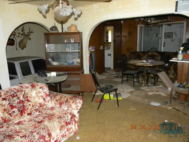 living room featuring arched walkways