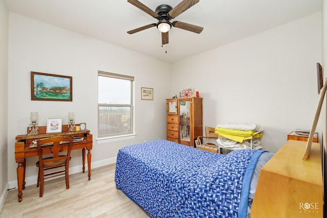 bedroom with ceiling fan and light hardwood / wood-style flooring