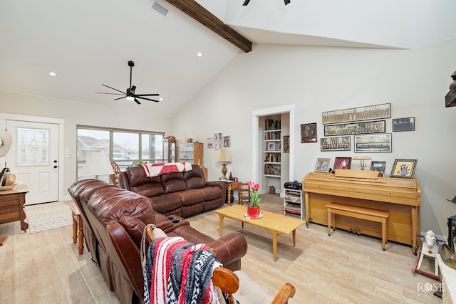 living room featuring beam ceiling, ceiling fan, light hardwood / wood-style floors, and high vaulted ceiling