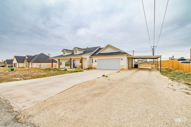 view of front of house featuring a garage and a carport