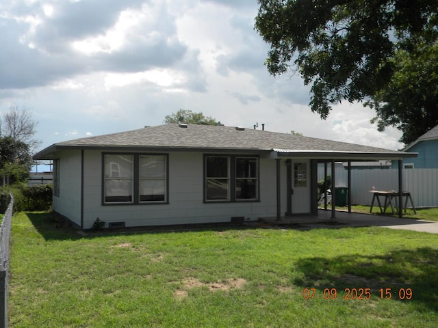 1611 N Magdalen St, San Angelo, TX 76901 - back of house featuring roof with shingles and a patio