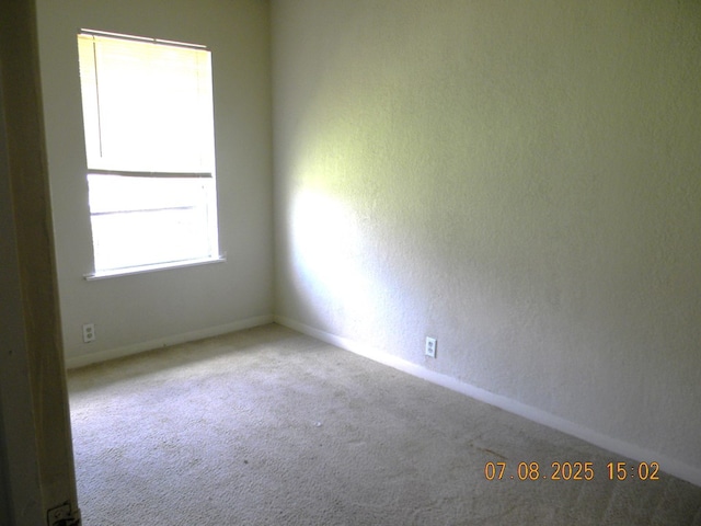 1611 N Magdalen St, San Angelo, TX 76901 - carpeted spare room with baseboards