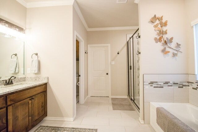 full bathroom with tile patterned floors, toilet, crown molding, separate shower and tub, and vanity