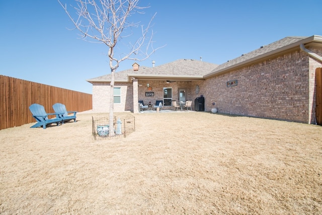 back of property with a patio