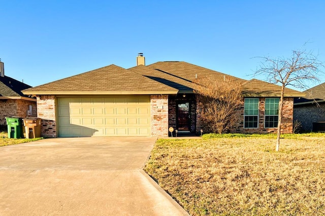 ranch-style home with a garage, brick siding, a chimney, and driveway