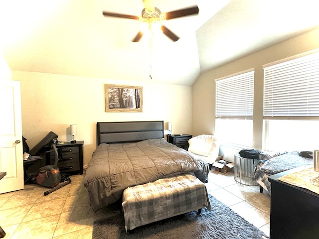 tiled bedroom featuring vaulted ceiling and ceiling fan