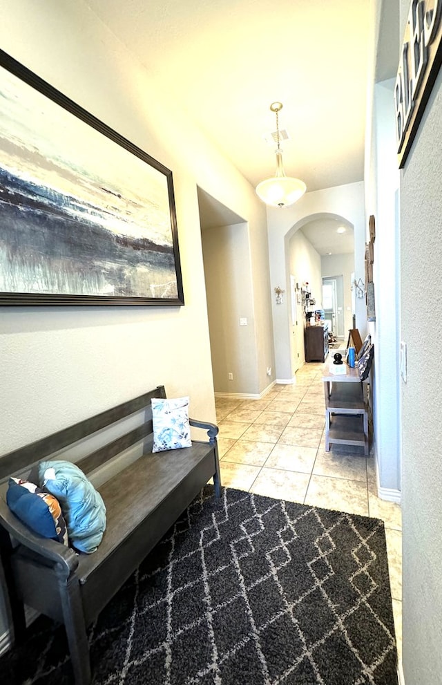 hallway featuring light tile patterned floors