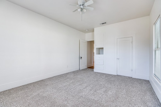 unfurnished bedroom with carpet flooring and ceiling fan