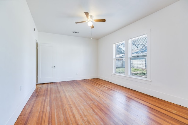 unfurnished room featuring light hardwood / wood-style flooring and ceiling fan