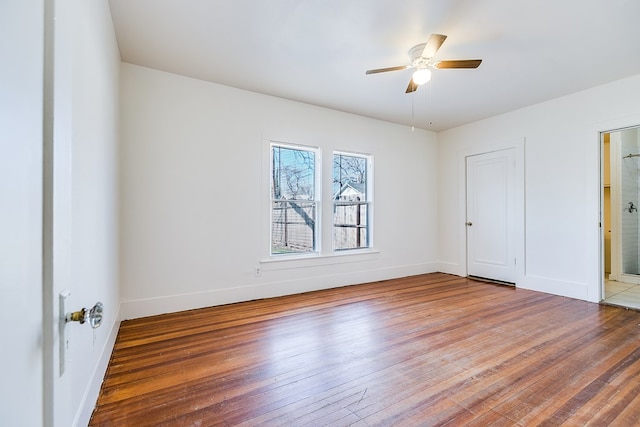 empty room featuring wood-type flooring and ceiling fan