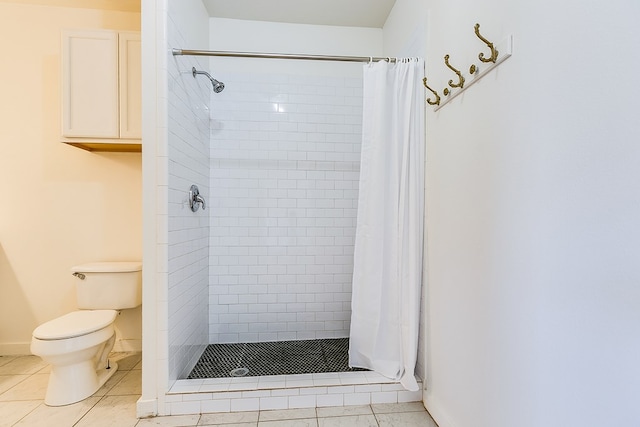 bathroom with walk in shower, toilet, and tile patterned flooring